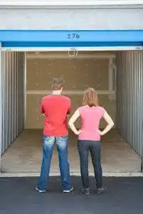 Montrose man and woman gazing into an empty storage unit that they just rented from All Secure Storage. 