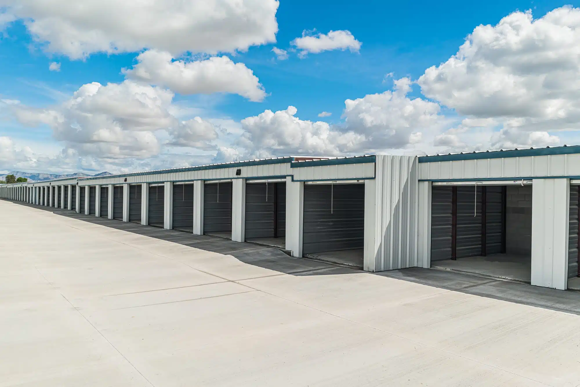 Row of storage units with rolled up doors