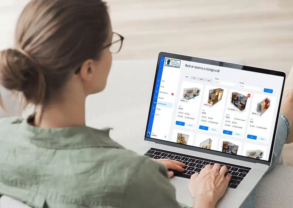 Woman using her laptop to rent storage online